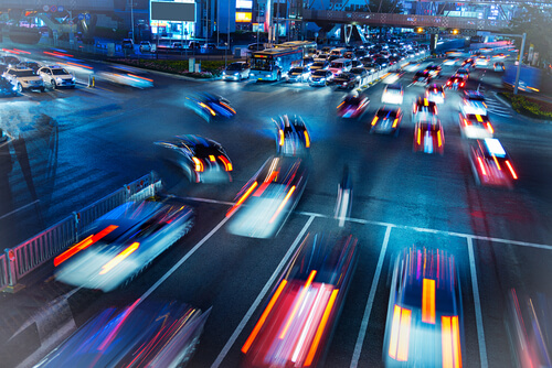 Image of a busy road with cars at night time